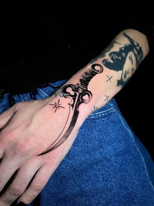 Small Blackwork Knife Tattoo on Men Forearm by @sire_emanuhell