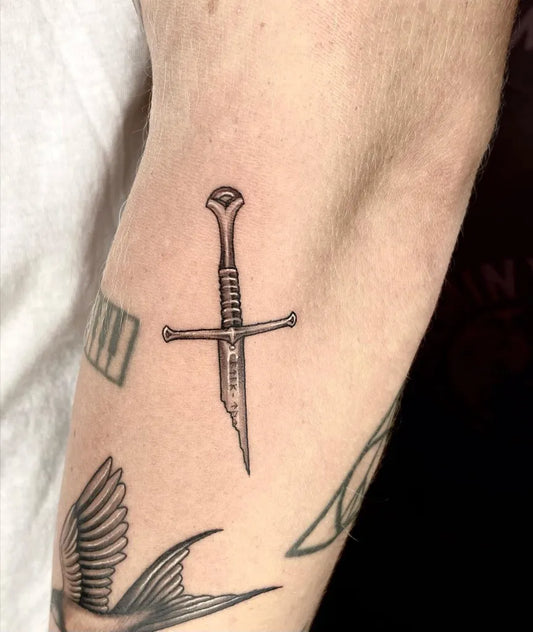 Small Blackwork Knife and Swallow Tattoo on Men Forearm by @seminyakink_finelineartwork