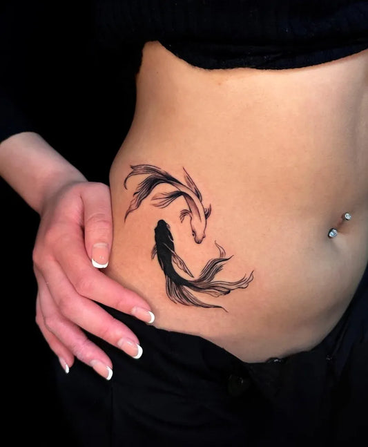 Small Blackwork Koi Fish Tattoo on Women Stomach by @hamnessy