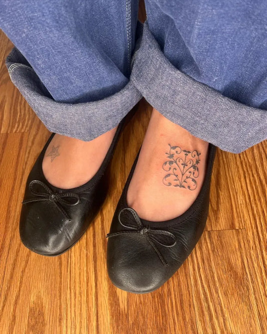 Small Blackwork Lace Tattoo on Women Foot by @whysproutedtattoo