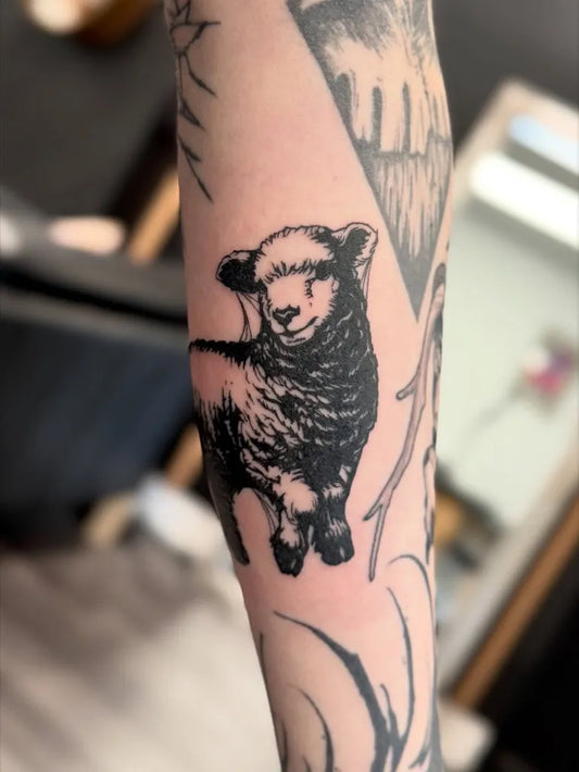 Small Blackwork Lamb on Men Forearm Tattoo by @mourningglorytattoos