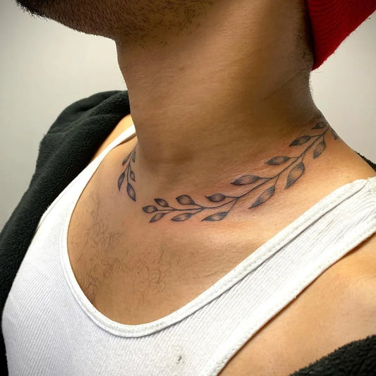 Small Blackwork Laurel Wreath Tattoo on Men Neck by @inkedd.byalex