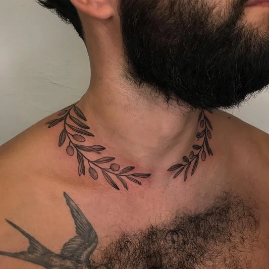 Small Blackwork Laurel Wreath and Swallow Tattoo on Men Neck by @ipektattoo