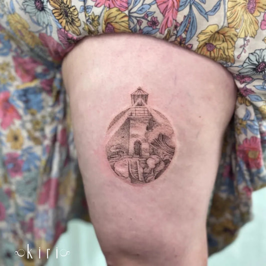 Small Blackwork Lighthouse in Orb Tattoo on Women Thigh by @kiri.vrs