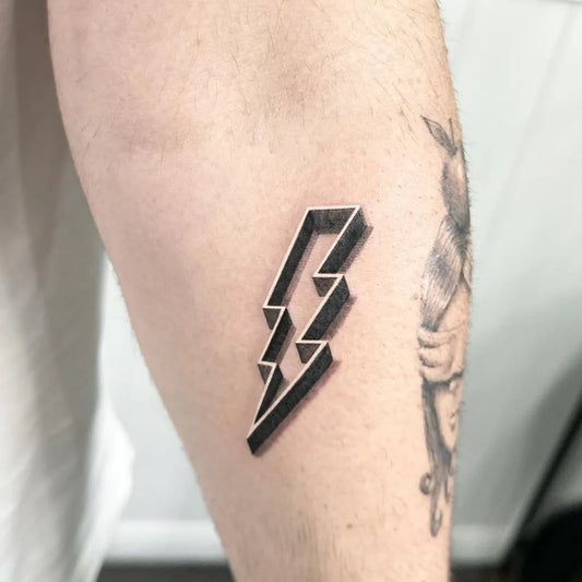 Small Blackwork Lightning Bolt Tattoo on Men Arm by @markingstattoos