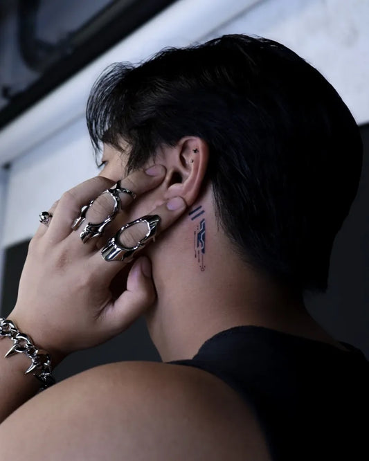 Small Blackwork Linework Tattoo on Men Behind the Ear by @nini.inks
