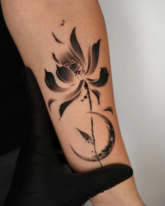 Small Blackwork Lotus and Crescent Moon Tattoo on Women Arm by @tattooist_mate
