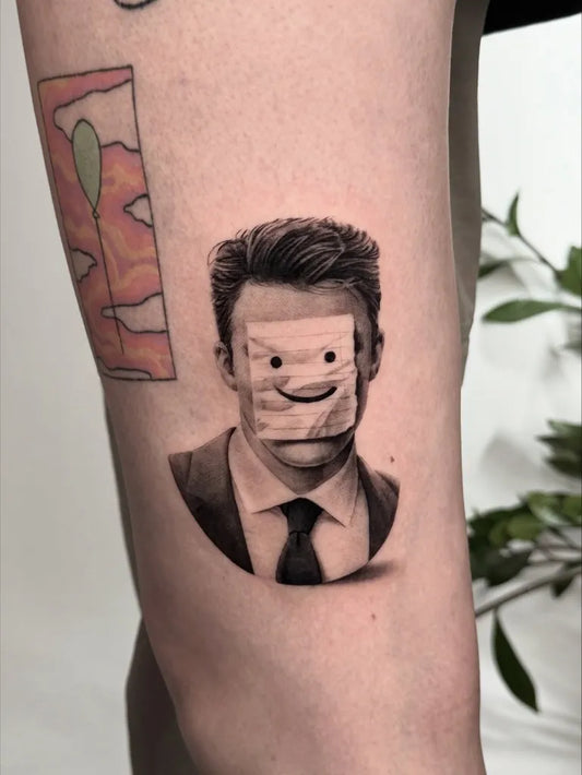 Small Blackwork Man with Paper Bag Mask Tattoo on Men Arm by @tattoo.by.anton