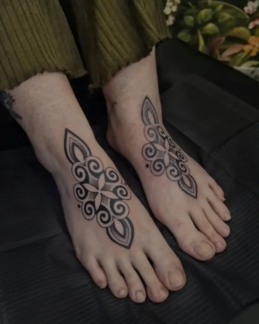 Small Blackwork Mandala Designs Tattoo on Women Foot by @classique.ink