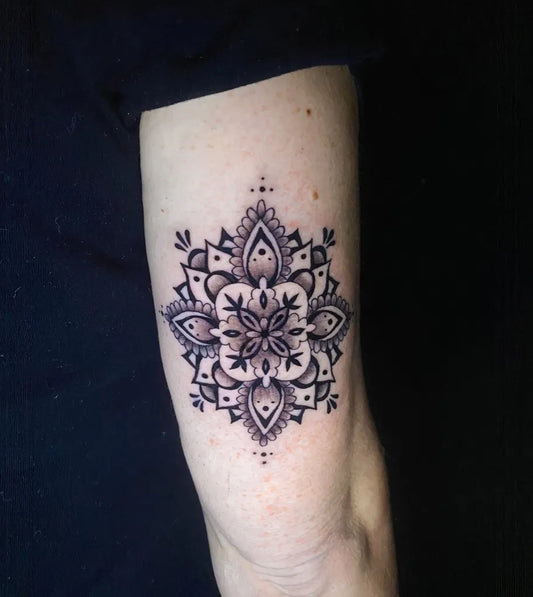 Small Blackwork Mandala Tattoo on Women Arm by @elisek.tattoo