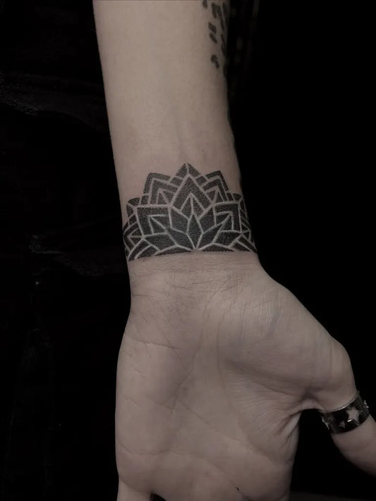 Small Blackwork Mandala Tattoo on Women Wrist by @feder_ink