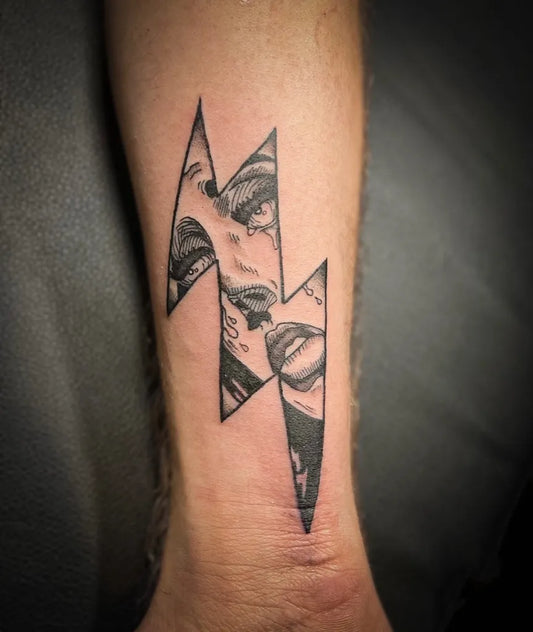 Small Blackwork Marilyn Monroe Lightning Bolt Tattoo on Men Wrist by @kamelia_tattoos
