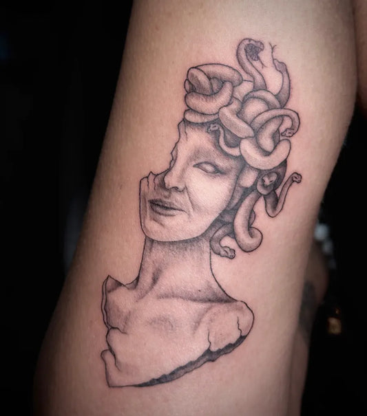 Small Blackwork Medusa Bust on Women Arm Tattoo by @ams.ink.x