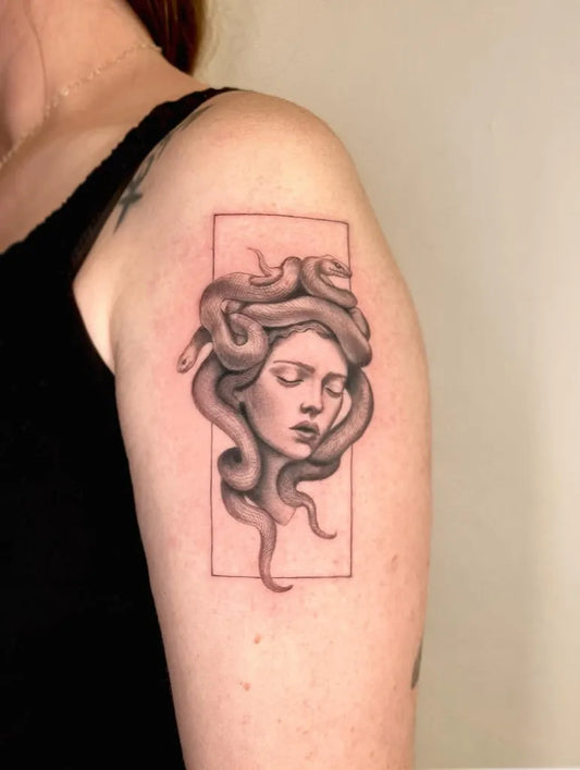 Small Blackwork Medusa Head on Women Shoulder Tattoo by @serena.ghiaroni.tattooer