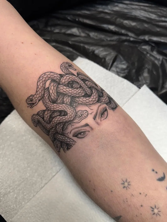 Small Blackwork Medusa Snakes Eyes on Women Arm Tattoo by @tattoosbycay