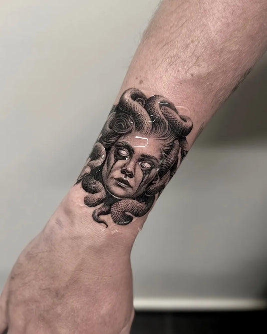 Small Blackwork Medusa on Men Wrist Tattoo by @eelinkportoheli