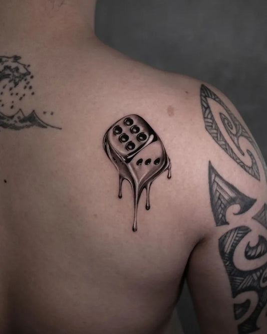 Small Blackwork Melting Dice Tattoo on Men Shoulder by @la_fleurie_guan