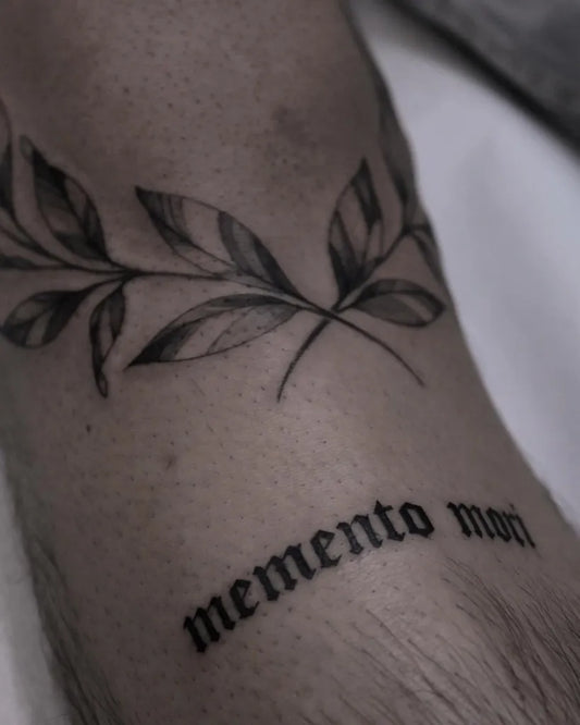 Small Blackwork Memento Mori Leaves on Men Wrist Tattoo by @justine.tattoo