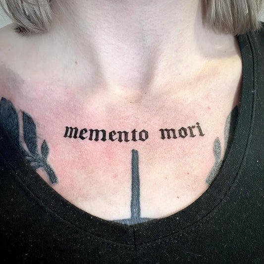 Small Blackwork Memento Mori Text and Feathers on Women Collarbone Tattoo by @nordlandic