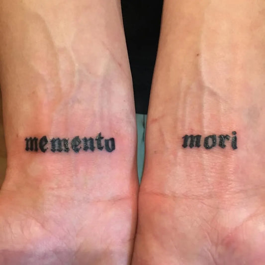 Small Blackwork Memento Mori on Women Wrist Tattoo by @scott_nguyen_tattoos