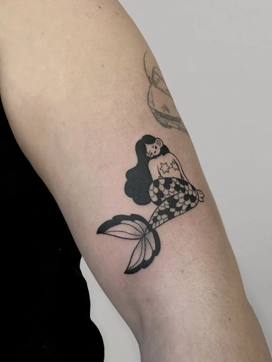 Small Blackwork Mermaid Tattoo on Women Arm by @pacocachadastattooacademy