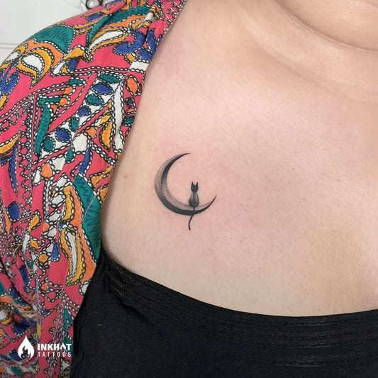 Small Blackwork Moon Cat Tattoo on Women Shoulder by @inkhot_tattoos