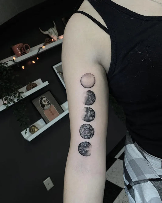 Small Blackwork Moon Phases Tattoo on Women Arm by @ashley_glovna