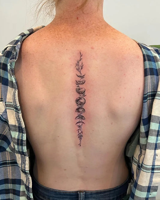 Small Blackwork Moon Phases Tattoo on Women Back by @gracedoestattoos