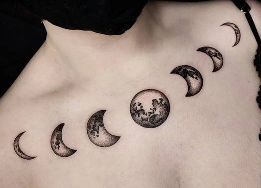 Small Blackwork Moon Phases Tattoo on Women Shoulder by @electra_creatives