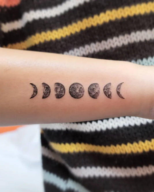 Small Blackwork Moon Phases Tattoo on Women Wrist by @tattoosbymarilyn
