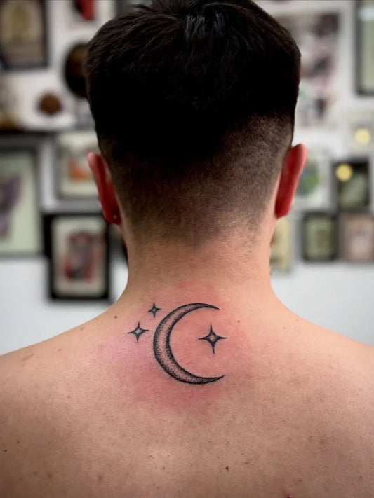 Small Blackwork Moon and Stars Tattoo on Men Neck by @aghost.handpoke