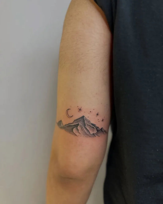 Small Blackwork Mountain and Moon Tattoo on Men Arm by @taxi_tattoo_shop