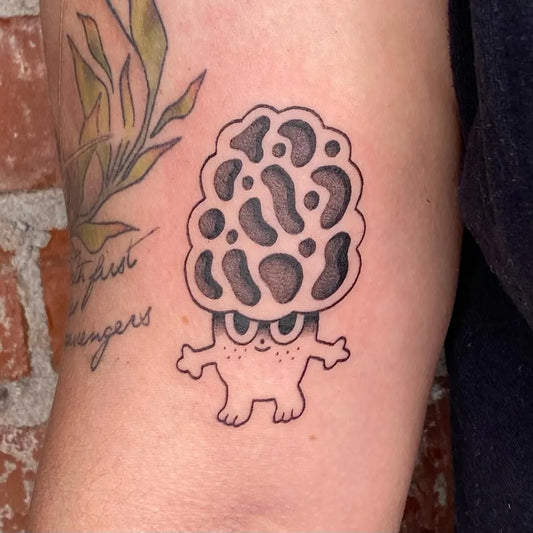 Small Blackwork Mushroom Character on Women Arm Tattoo by @pure_foolery