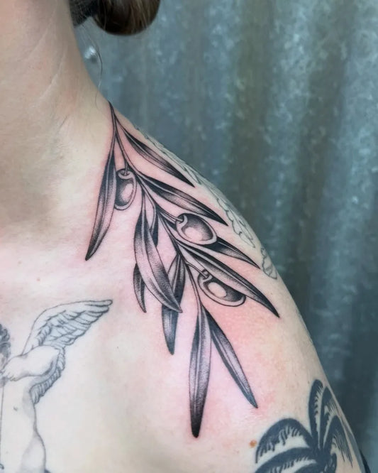 Small Blackwork Olive Branch Tattoo on Men Shoulder by @julzktattoo
