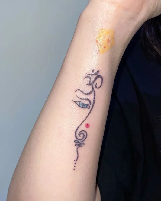 Small Blackwork Om Symbol and Eye Spiritual Tattoo on Women Wrist by @minkin.tt