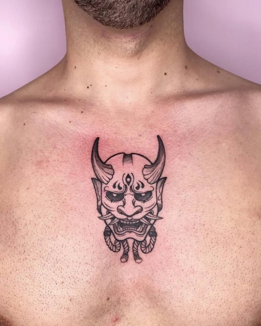 Small Blackwork Oni Mask on Men Neck Tattoo by @artlien.tattoo