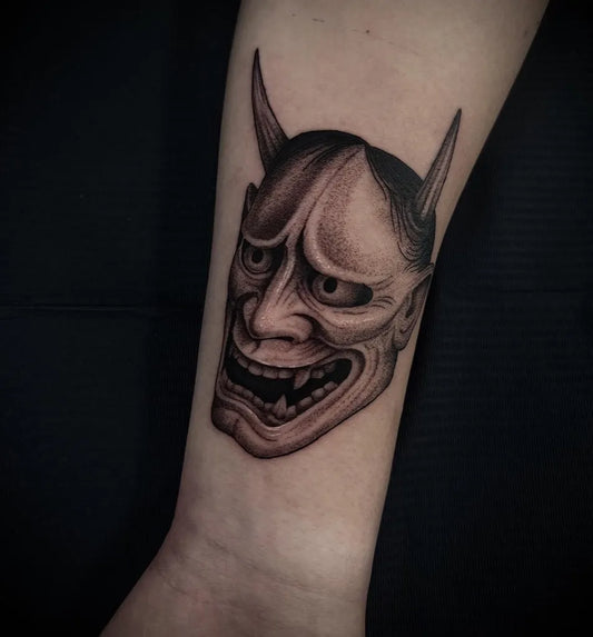 Small Blackwork Oni Mask on Women Forearm Tattoo by @sin_one_tattoo