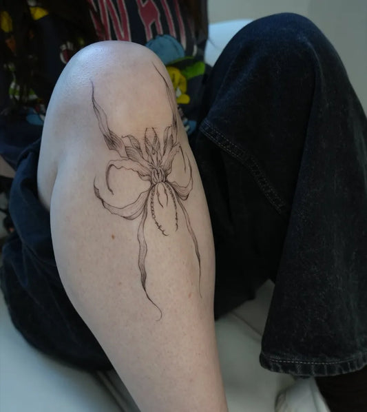 Small Blackwork Orchid Tattoo on Women Knee by @ksumonni