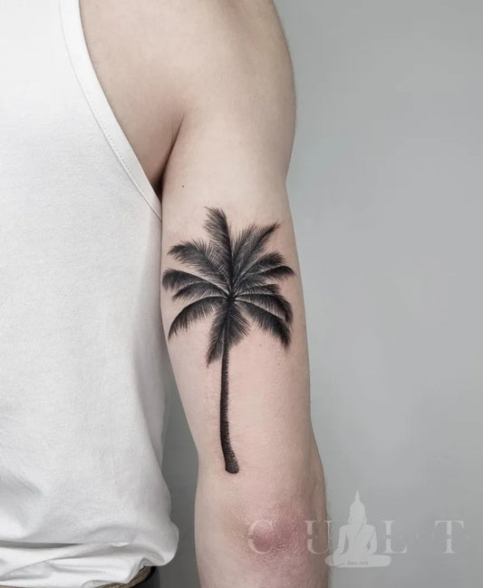 Small Blackwork Palm Tree Tattoo on Men Arm by @culthamburgpiercingtattoo