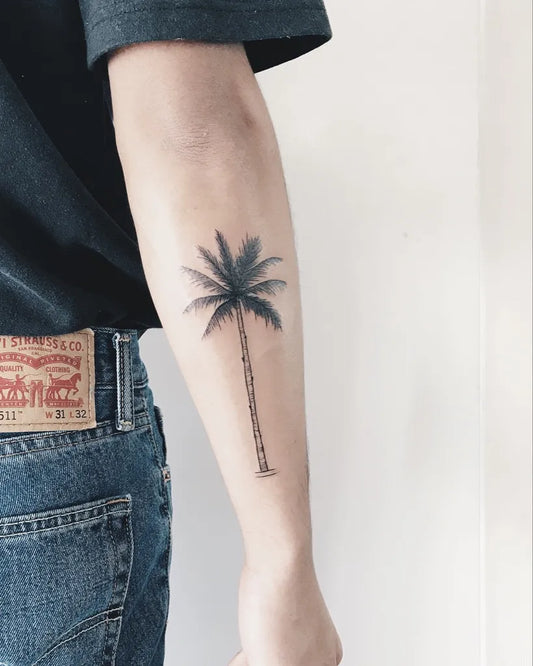 Small Blackwork Palm Tree Tattoo on Men Arm by @hailey_blossom