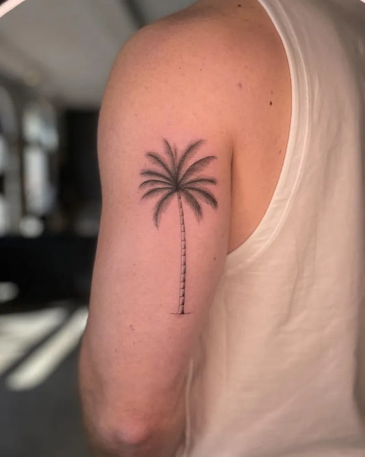 Small Blackwork Palm Tree Tattoo on Men Upper Arm by @ironsideink