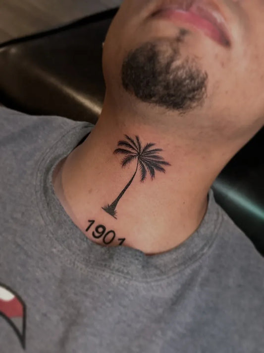Small Blackwork Palm Tree and 1901 Tattoo on Men Throat by @messiastattooartist