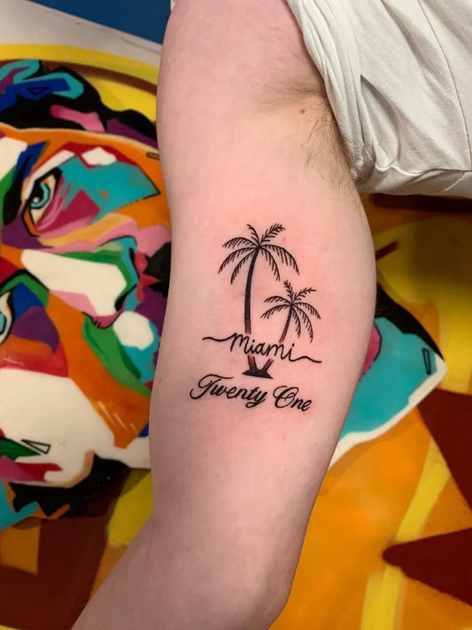 Small Blackwork Palm Trees and Script Tattoo on Men Arm by @zestyzacchtattoos