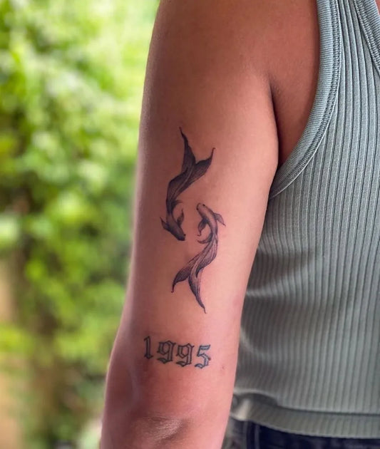 Small Blackwork Pisces Tattoo on Women Arm by @esperanzainktattoos