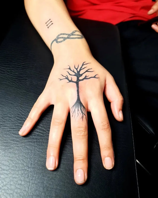 Small Blackwork Poison Tree Rope and Roman Numerals on Women Hand Tattoo by @jeremy_celisss