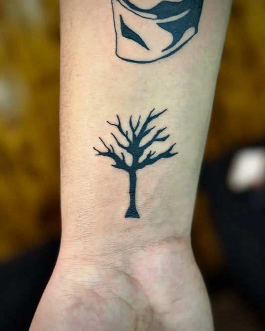 Small Blackwork Poison Tree on Women Wrist Tattoo by @martin_ink1