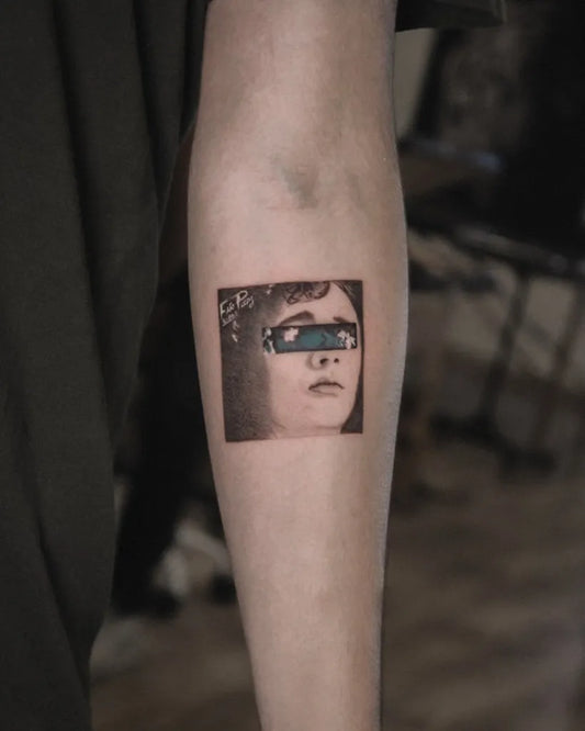 Small Blackwork Portrait Tattoo on Women Arm by @bastian_fineline