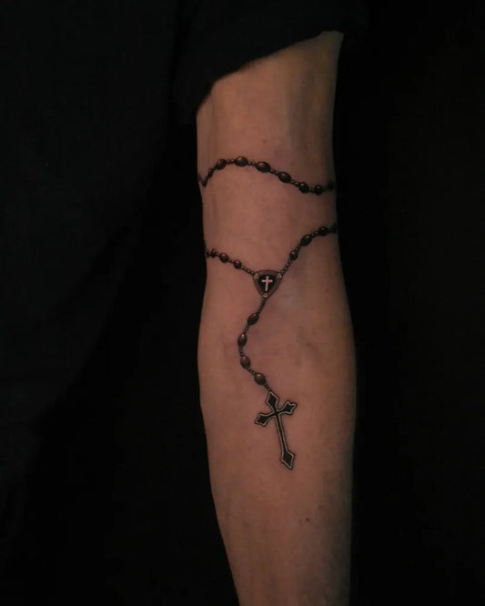 Small Blackwork Rosary Beads Cross on Men Arm Tattoo by @logans.ink