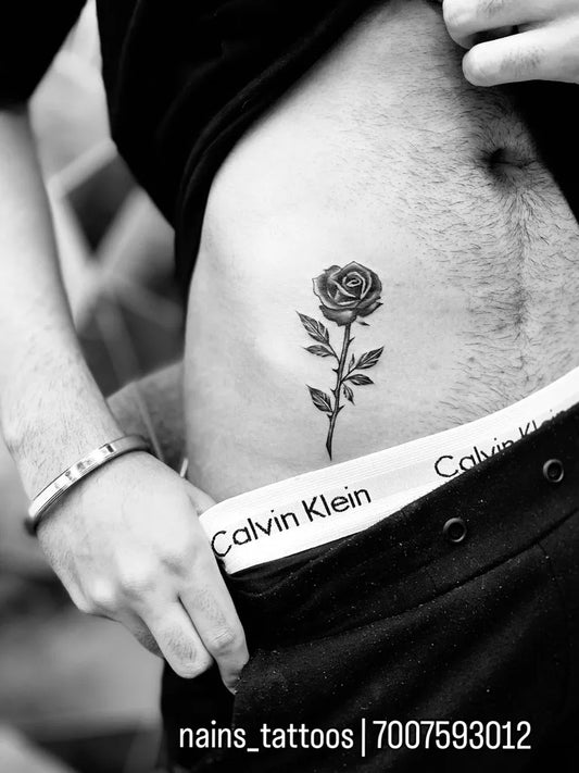 Small Blackwork Rose on Men Hip Tattoo by @nains_tattoos