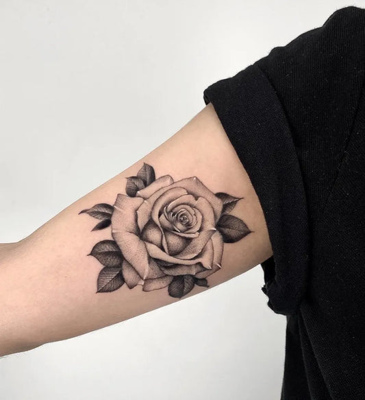 Small Blackwork Rose on Women Arm Tattoo by @dptattoos